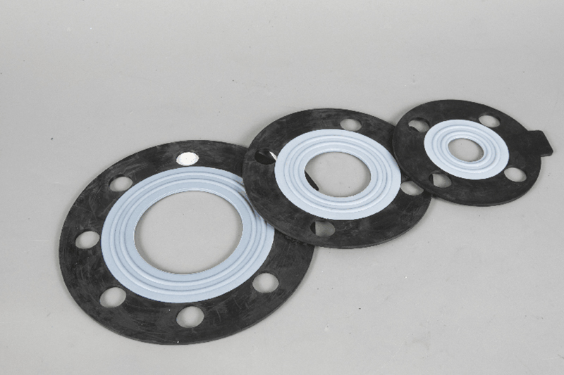 Non-metallic gasket for tightening between the connecting electronics and the nut